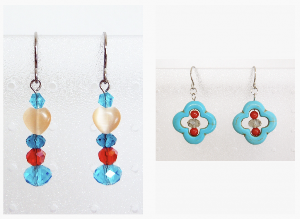 Two sets of earrings side-by-side in Artisans Cooperative colors of teal, blue, dark coral and off-white. One is arabesque style and the other is a stack of beads with a heart in the middle