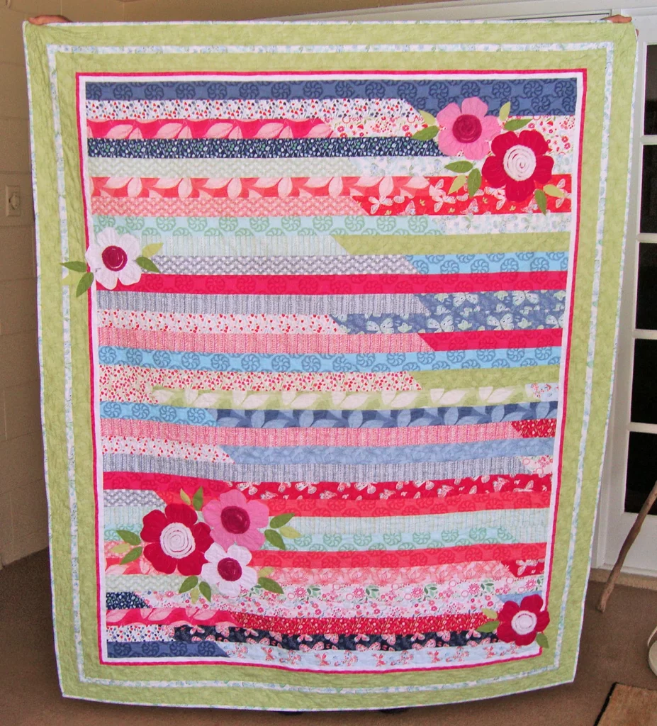 a handmade spring floral quilt by Jambearies, in beautiful spring colors