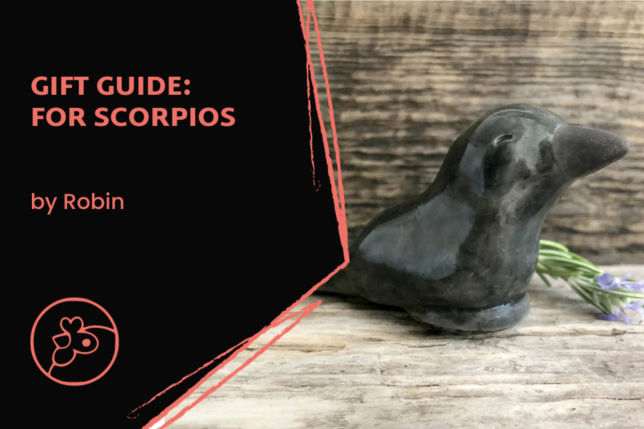 Blog Post Cover Image with a picture of a black raven statuette handthrown raku pottery and the title Gift Guide: for Scorpios, by Robin