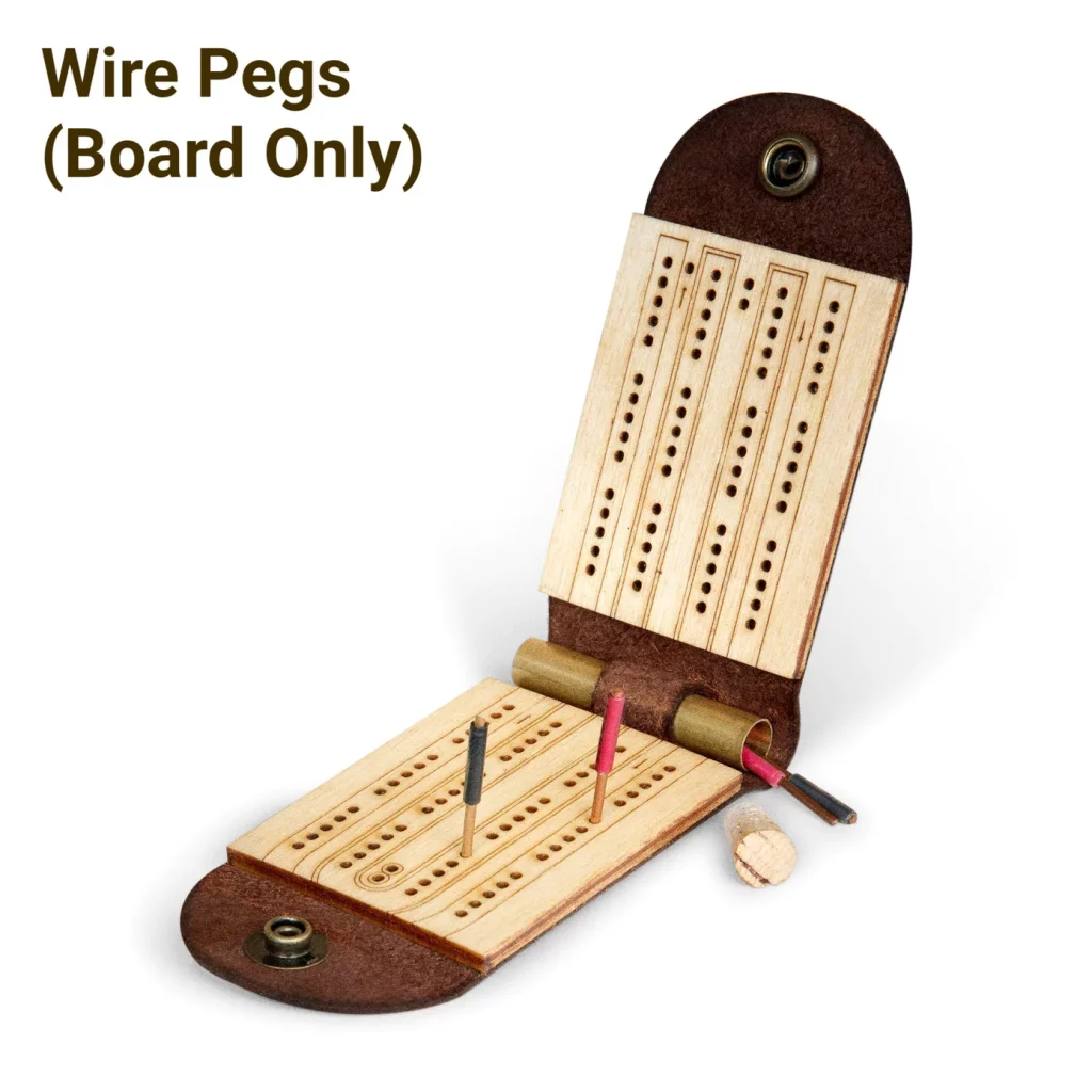 Travel cribbage board made from wood and leather and quickly copper wire pegs for easy replacement at any hardware store for world travelers who like to play games