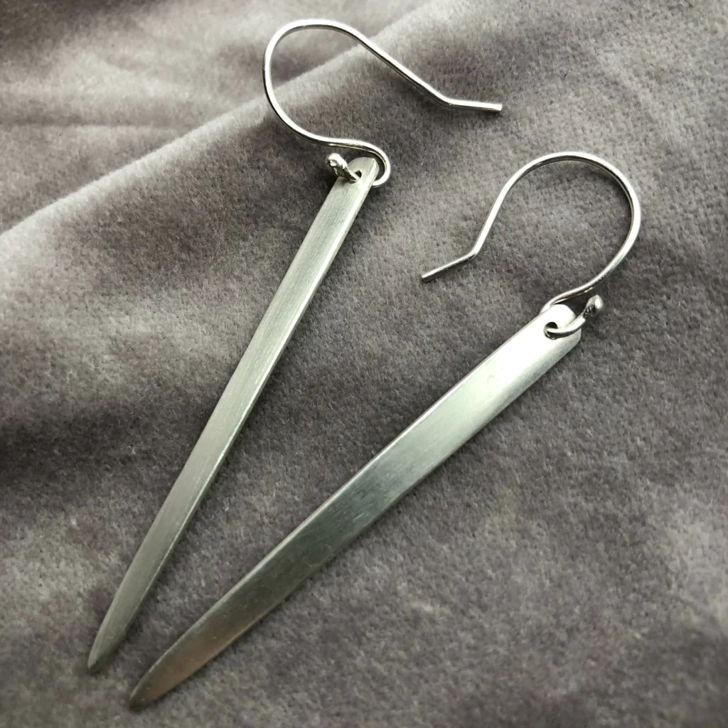 Long dangling silver bar earrings with a simple and minimalist design that would go with almost anything