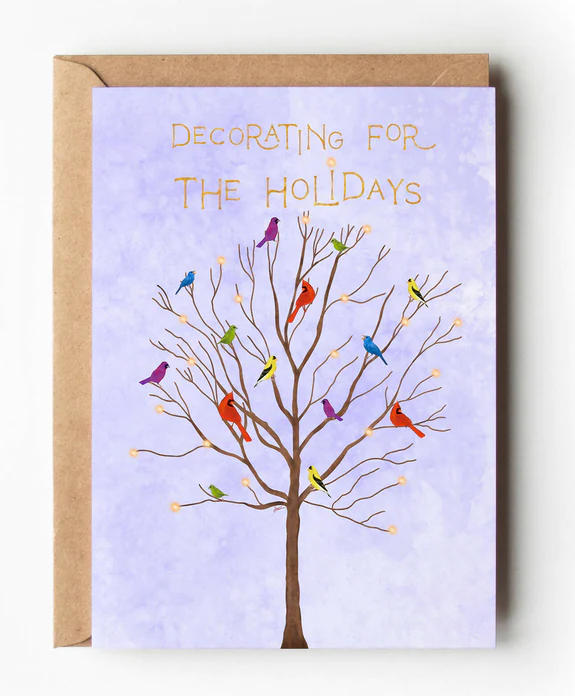 An intersectional holiday greeting card with a bare tree filled with multi colored birds and the title Decorating for the Holidays