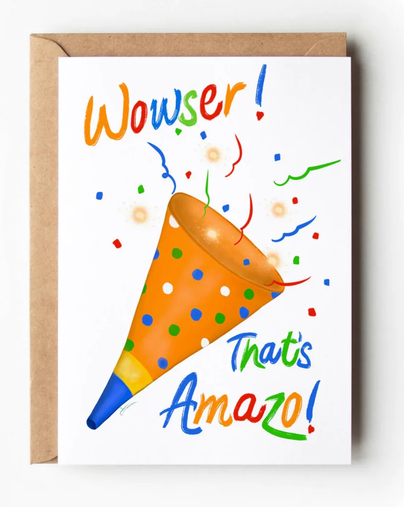 The cover of the greeting card says "Wowser!" at the top left and "That's Amazo!" at the bottom right. All words are in alternating colors of blue, orange, red, and green. In between the two phrases is a party horn (also in those colors) spraying confetti. Behind the card is the brown envelope.