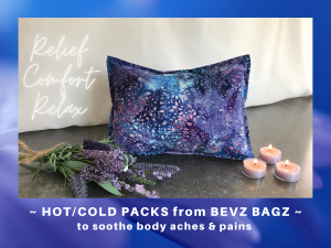 A graphic with a blue-purple border with white text at the bottom that reads, "Hot/cold packs from Bevz Bagz to soothe body aches & pains."
The photo within the graphic features a purple, blue and indigo/navy hot pack cover with pink speckling. To its left is a bundle of lavender, and to its right sit three tealights. To the left of the pack is white, cursive font that reads, "Relief, Comfort, Relax."