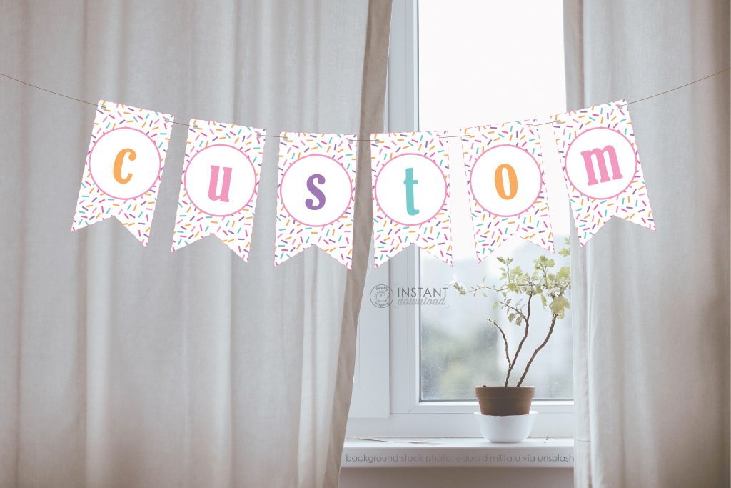A pretty and clean living room with a printed banner. Each page of the banner is one printed page with one letter and it spells out the word 'custom'. It's a digital download for printing custom banners.